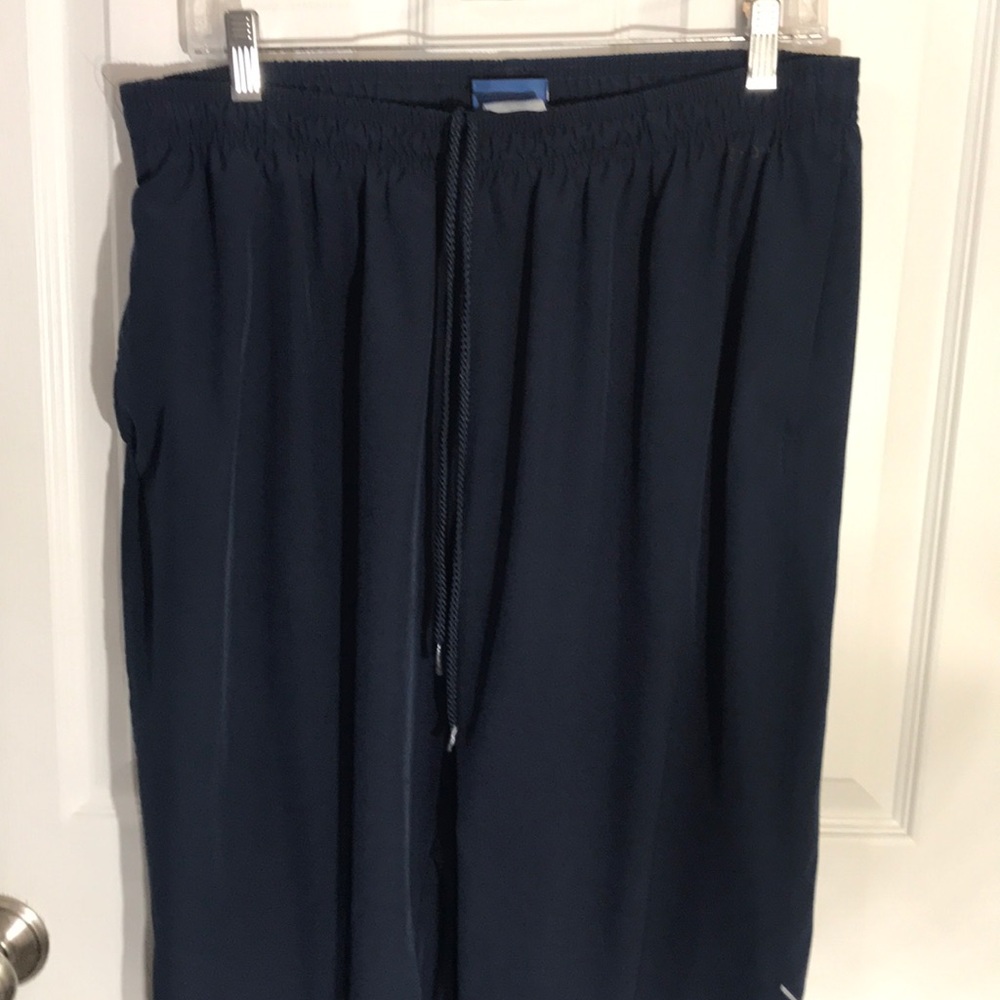 Navy reebok sweat pants with zipper bottoms